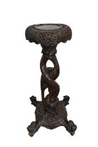 Late 19th century Burmese carved hardwood plant table with circular top on carved legs with dragon’s