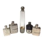 Two silver spirit flasks and three others with silver plated mounts.