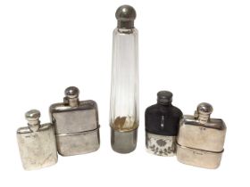 Two silver spirit flasks and three others with silver plated mounts.