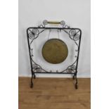 Antique dinner gong, in ornate wrought iron frame, 80cm wide