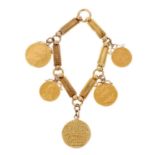 Gold charm bracelet with five gold coins