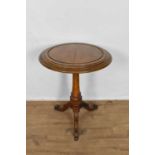 Mid Victorian oak occasional table, the circular top of facetted baluster column and tripod base, 65