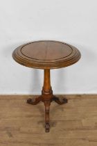 Mid Victorian oak occasional table, the circular top of facetted baluster column and tripod base, 65