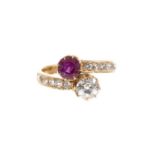 Early 20th century ruby and diamond two stone cross-over ring
