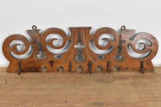 18th/19th century French chestnut hanging rack, of pierced scrolling form, 75cm wide