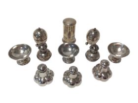 Selection of Victorian and later silver pepper pots (various dates and makers),