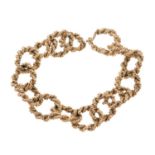 Heavy 9ct gold bracelet with rope twist loops