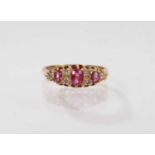 Victorian style ruby and diamond ring with three oval mixed cut rubies and six diamonds in 18ct gold