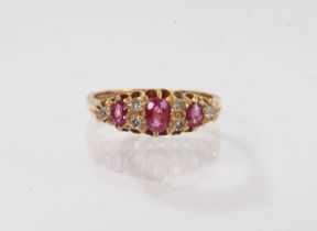 Victorian style ruby and diamond ring with three oval mixed cut rubies and six diamonds in 18ct gold