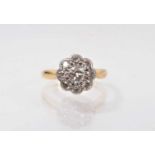 Antique diamond cluster ring with a flower head cluster ring with old cut diamonds in platinum setti