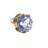 Synthetic blue spinel cocktail ring with a large cushion cut stone in 9ct yellow gold setting, ring