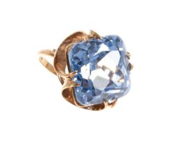 Synthetic blue spinel cocktail ring with a large cushion cut stone in 9ct yellow gold setting, ring