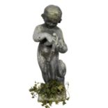 Antique lead garden sculpture, in the form of a putto with dove, on square integral plinth, 74cm hig