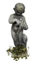 Antique lead garden sculpture, in the form of a putto with dove, on square integral plinth, 74cm hig