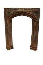 19th century gothic cast iron fire surround, typical arched cluster column form,