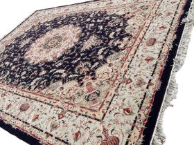 Good quality Tabriz style rug, retailed by the Mashad Carpet Co, with central foliate medallion on n