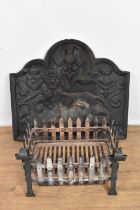 Cast iron fire back and a wrought iron fire basket