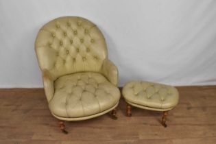 Victorian style button leather tub chair and en-suite footstool, raised on turned oak legs and casto