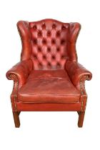 Georgian style red button leather upholstered wing armchair, on square supports