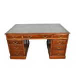 Georgian style mahogany twin pedestal desk with tooled green leather top, eight drawers with brass h