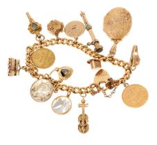 Gold charm bracelet with a collection of gold and yellow metal charms to include a gold half soverei