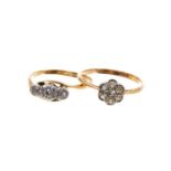 Two early 20th century 18ct gold and diamond rings to include a daisy cluster with seven old cut dia