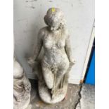 Garden statue, 67cm high, together with a chimney pot, 79cm high (2)