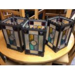 Three Gothic style stained glass lanterns, formerly hanging outside a pub