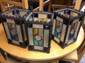 Three Gothic style stained glass lanterns, formerly hanging outside a pub