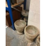 Collection of concrete garden urns