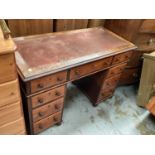 Victorian mahogany twin pedestal desk with seven drawers and turned handles, 110cm wide, 52cm deep,