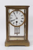Late 19th century brass four glass mantel clock with mercury pendulum.