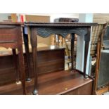 Antique carved mahogany serpentine fronted card table with fold over top on turned legs and pad feet