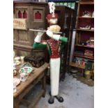 Life size tin model of a soldier playing a pipe