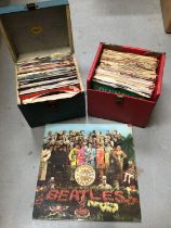 The Beatles Sgt. Pepper LP, PMC 7027 complete, together with two vintage cases of single records inc