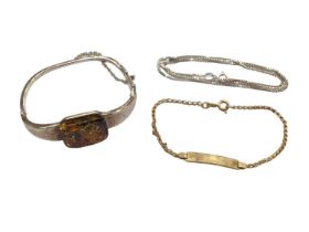 Silver and amber bangle, silver chain and a 9ct gold identity bracelet