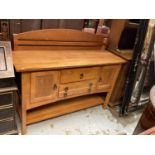 Hardwood sideboard with raised ledge back, two central drawers below flanked by cupboards, 138cm wid