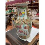 19th century Chinese porcelain vase decorated in the Cantonese famille rose pallete, 36cm in height.