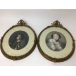 Pair of oval pictures in ornate gilt frames
