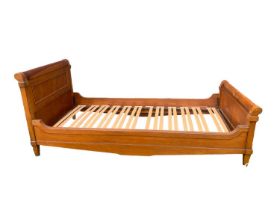 Stained hardwood single sleigh bed, 210cm long x 100cm wide overall. (Fits a 6ft6 x 3ft mattress siz