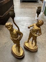 Pair of French gilded lamps, signed