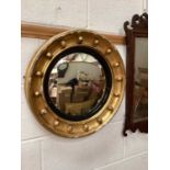Round convex giltwood wall mirror