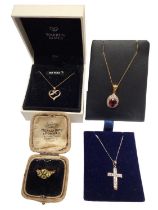Two 9ct gold diamond set pendants on 9ct gold chains, 9ct white gold synthetic stone cross pendant o