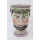 A pearlware Bacchus mask mug, circa 1800