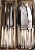 Composite set of twelve dinner knives with silver handles and other dessert knives