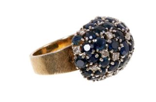 1960s sapphire and diamond cluster ring with a bombé cluster of pavé-set round mixed cut blue sapphi