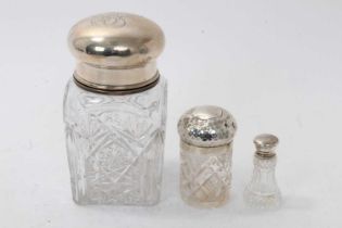 Large cut glass jar, with white metal cover and inner cover, and two silver topped dressing table ja