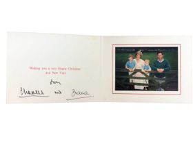 T.R.H. The Prince and Princess of Wales, signed 1989 Christmas card, with twin gilt ciphers to cover