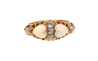 Victorian opal and diamond ring with two heart-shape opal cabochons and five old cut diamonds in gol