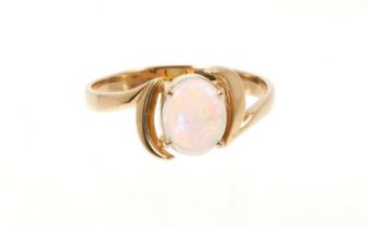 Opal single stone ring with an oval opal cabochon measuring approximately 8.5 x 7mm in 14ct gold cro